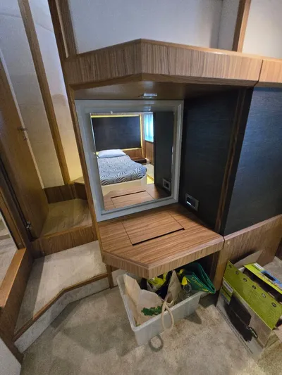  Yacht Photos Pics Luxurious interior of 2015 Absolute 56 FLY yacht with wooden vanity and mirror.