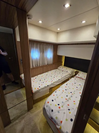  Yacht Photos Pics Interior of 2015 Absolute 56 FLY yacht with twin beds and modern decor.