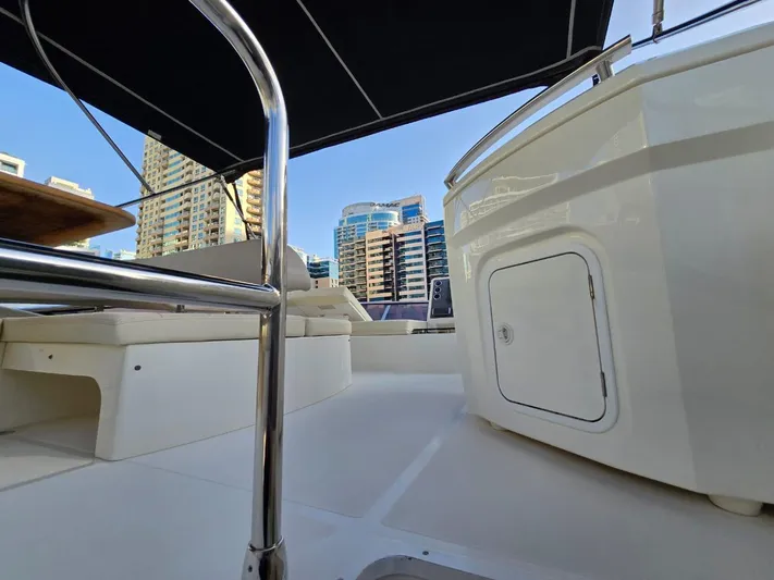  Yacht Photos Pics Luxurious Absolute 56 FLY yacht deck with city skyline, 2015 model.
