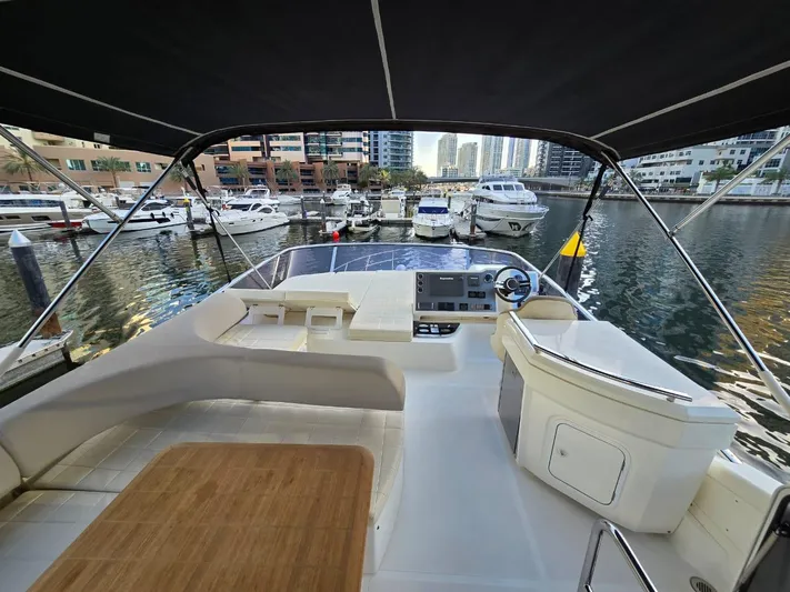  Yacht Photos Pics Flybridge view of 2015 Absolute 56 FLY yacht docked in a marina.
