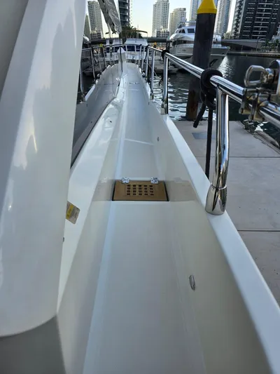  Yacht Photos Pics 2015 Absolute 56 FLY yacht docked, showcasing sleek side deck and modern railing.