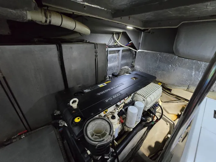  Yacht Photos Pics Engine room of a 2015 Absolute 56 FLY yacht, featuring a Volvo Penta engine.