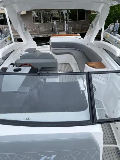  Yacht Photos Pics 2024 NX Boats 280 Xtreme interior with sleek seating and modern design.