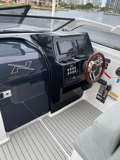  Yacht Photos Pics 2024 NX Boats 280 Xtreme cockpit with modern controls and sleek design.