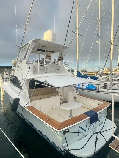  Yacht Photos Pics 2000 Ocean Yachts 48 docked, featuring spacious deck and flybridge.