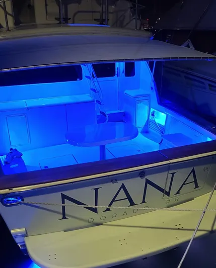  Yacht Photos Pics Ocean Yachts 48, 2000 model, illuminated deck with blue lighting at night.