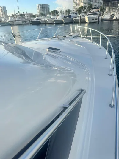  Yacht Photos Pics Ocean Yachts 48, 2000 model, docked in marina with cityscape background.