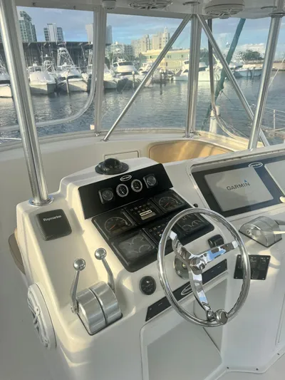  Yacht Photos Pics Control panel of a 2000 Ocean Yachts 48, docked at a marina.