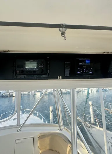  Yacht Photos Pics Ocean Yachts 48, 2000 model, helm electronics with marina view.