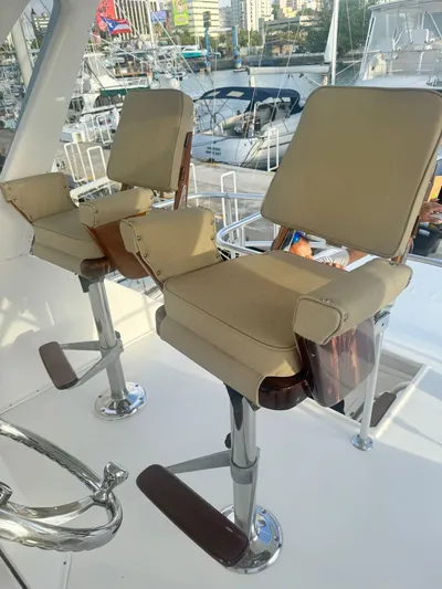  Yacht Photos Pics Two beige captain chairs on a 2000 Ocean Yachts 48 boat deck.