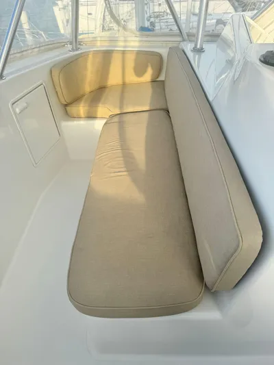  Yacht Photos Pics 2000 Ocean Yachts 48 interior seating with beige cushions.