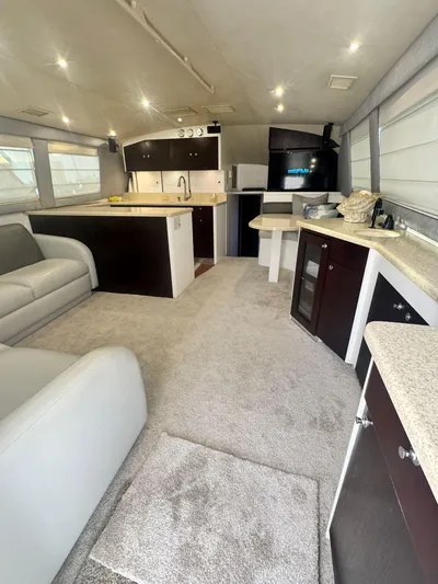  Yacht Photos Pics Luxurious interior of 2000 Ocean Yachts 48 with modern kitchen and seating area.