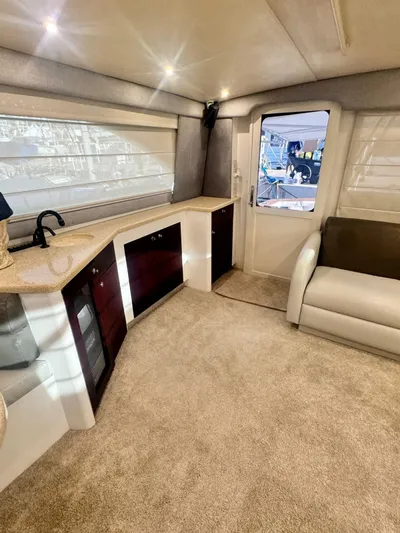  Yacht Photos Pics Luxurious interior of 2000 Ocean Yachts 48, featuring plush seating and modern cabinetry.