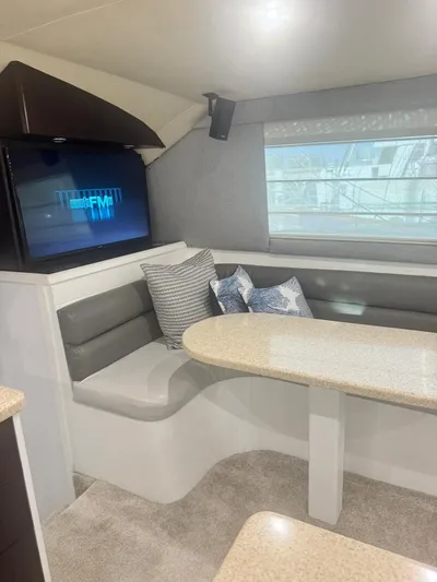  Yacht Photos Pics Interior of 2000 Ocean Yachts 48 with modern seating and TV.