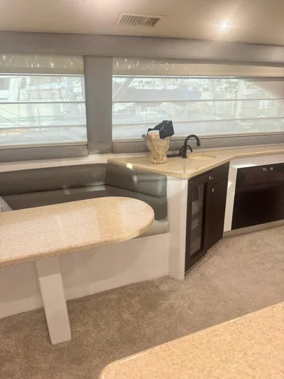  Yacht Photos Pics Interior of 2000 Ocean Yachts 48, featuring a cozy dining area and modern kitchen.