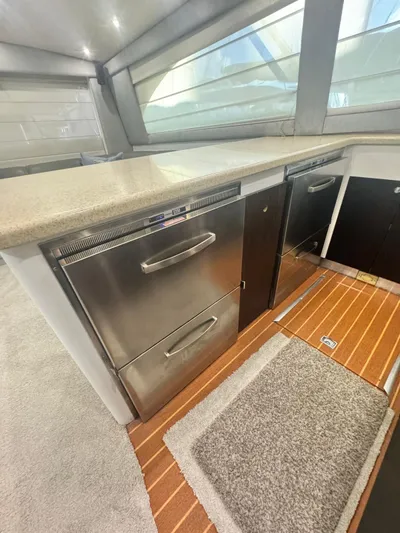  Yacht Photos Pics Modern kitchen area in 2000 Ocean Yachts 48 with stainless steel appliances.