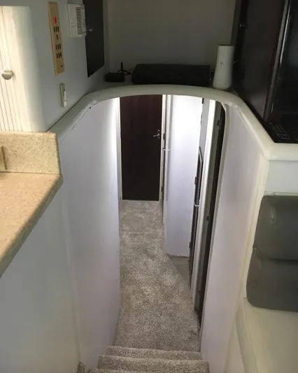  Yacht Photos Pics Interior view of 2000 Ocean Yachts 48, featuring a carpeted stairway and modern design.