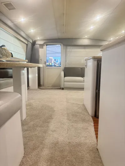  Yacht Photos Pics Interior of 2000 Ocean Yachts 48, featuring modern seating and carpeted flooring.