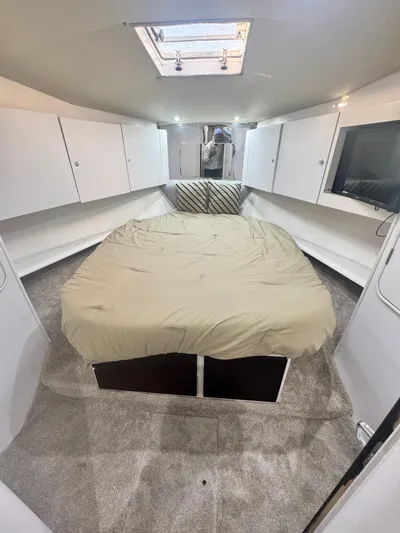  Yacht Photos Pics Interior of 2000 Ocean Yachts 48 with cozy bed and modern amenities.