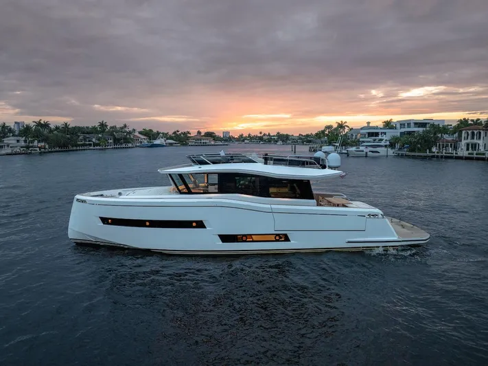  Yacht Photos Pics 2022 Pardo Yachts E60 cruising at sunset on a serene waterway.
