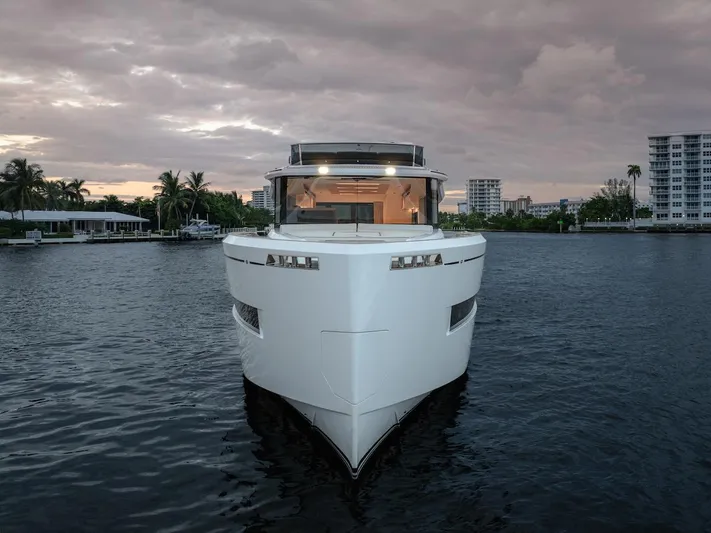  Yacht Photos Pics Front view of 2022 Pardo Yachts E60 on calm water at dusk.