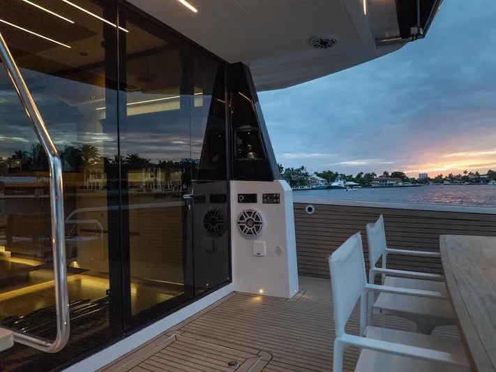  Yacht Photos Pics Luxurious 2022 Pardo Yachts E60 deck at sunset, featuring elegant seating and modern design.