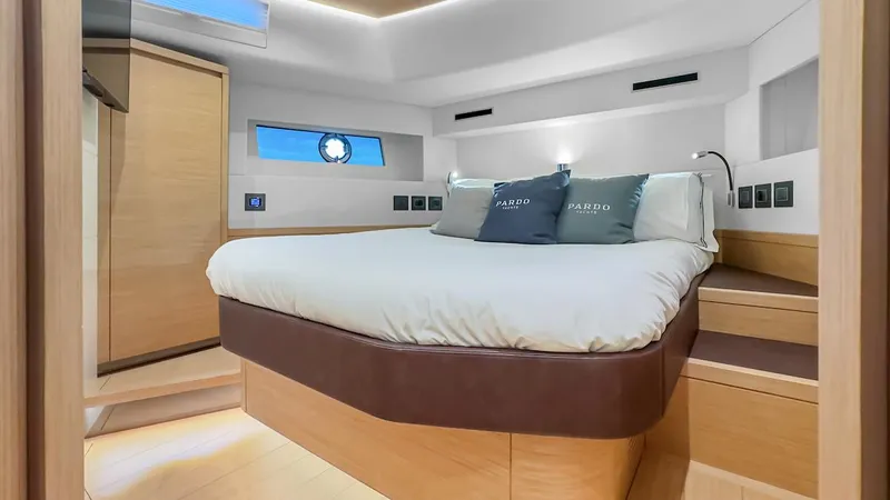  Yacht Photos Pics Luxurious bedroom interior of 2022 Pardo Yachts E60 with modern design and cozy bedding.