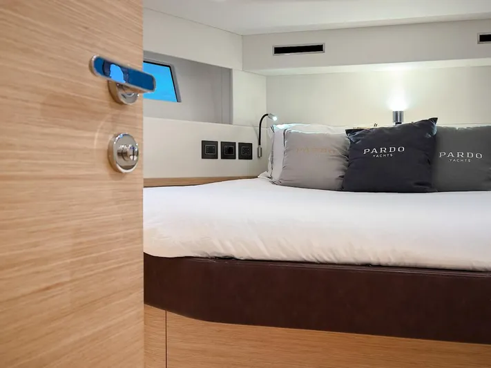  Yacht Photos Pics Luxurious bedroom interior of 2022 Pardo Yachts E60 with modern design and cozy bedding.