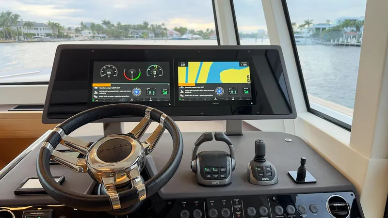 Yacht Photos Pics Pardo Yachts E60 2022 helm with dual navigation screens and steering wheel.
