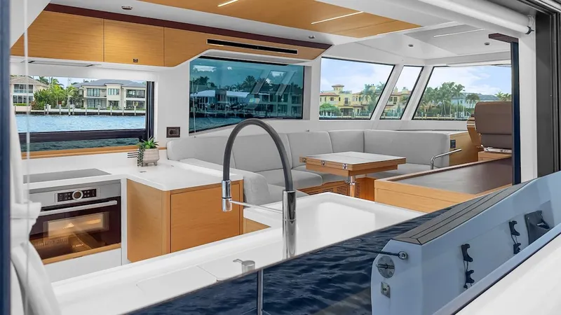  Yacht Photos Pics Luxurious interior of 2022 Pardo Yachts E60 with modern kitchen and seating area.