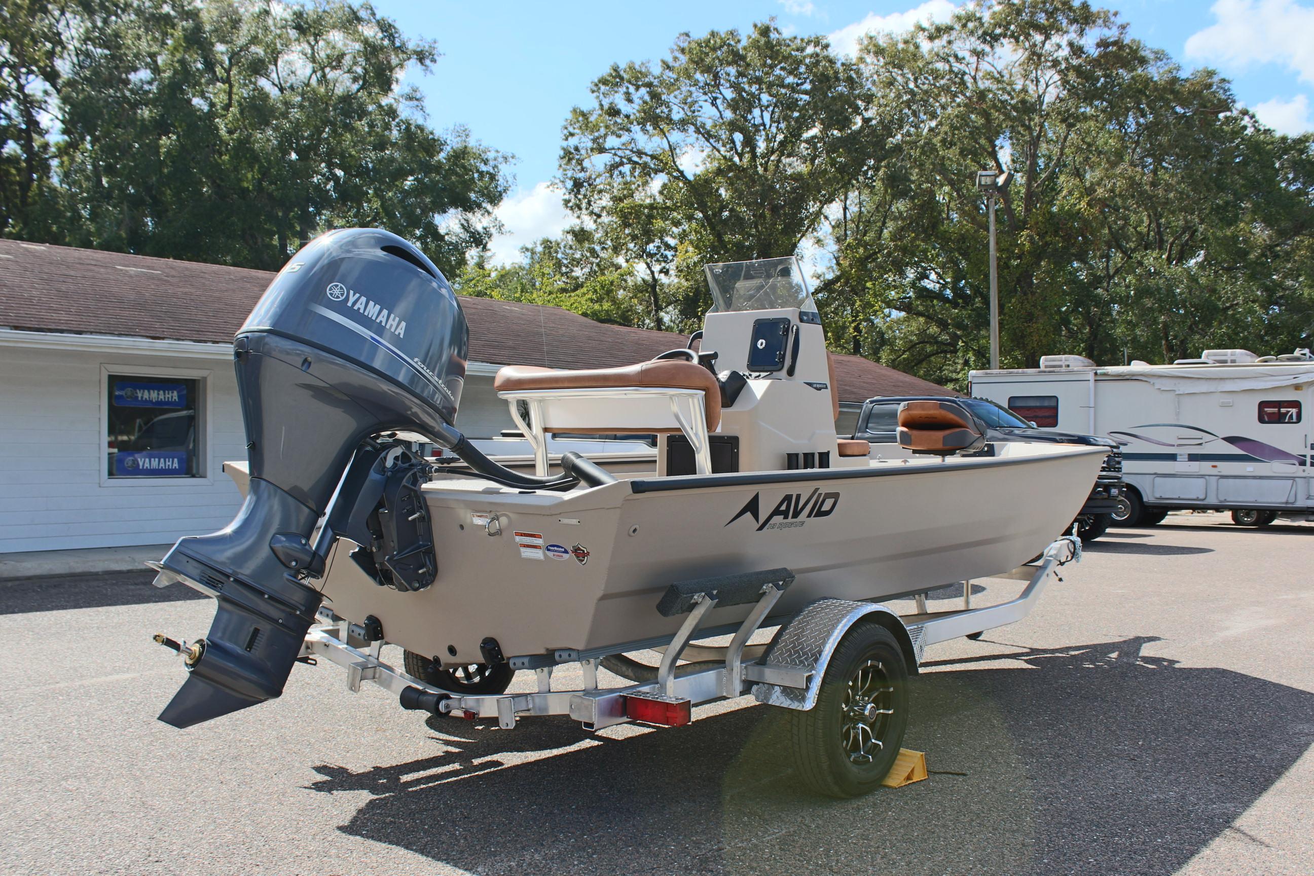2025 Avid 18 Rogue CC boat with Yamaha motor on trailer, parked outdoors.