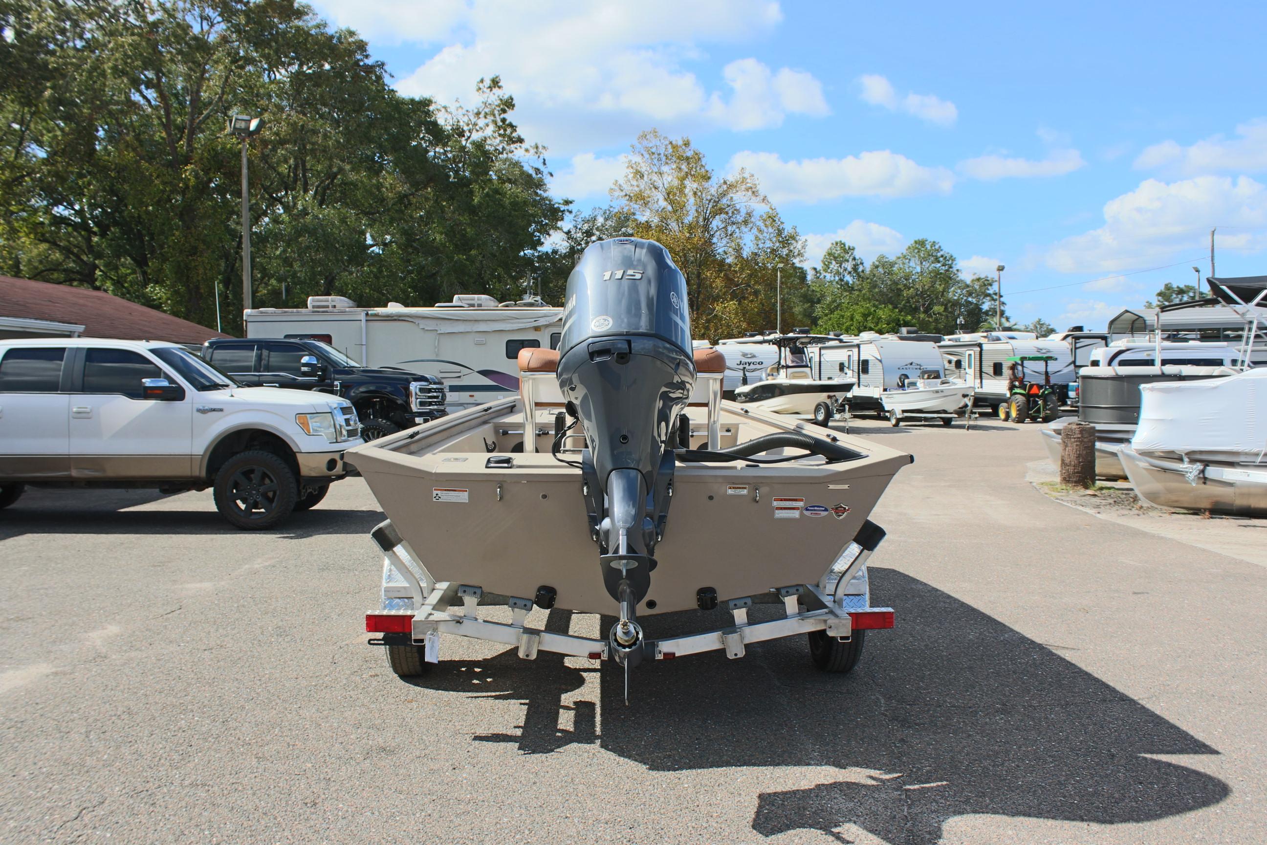 2025 Avid 18 Rogue CC boat on trailer, parked outdoors.