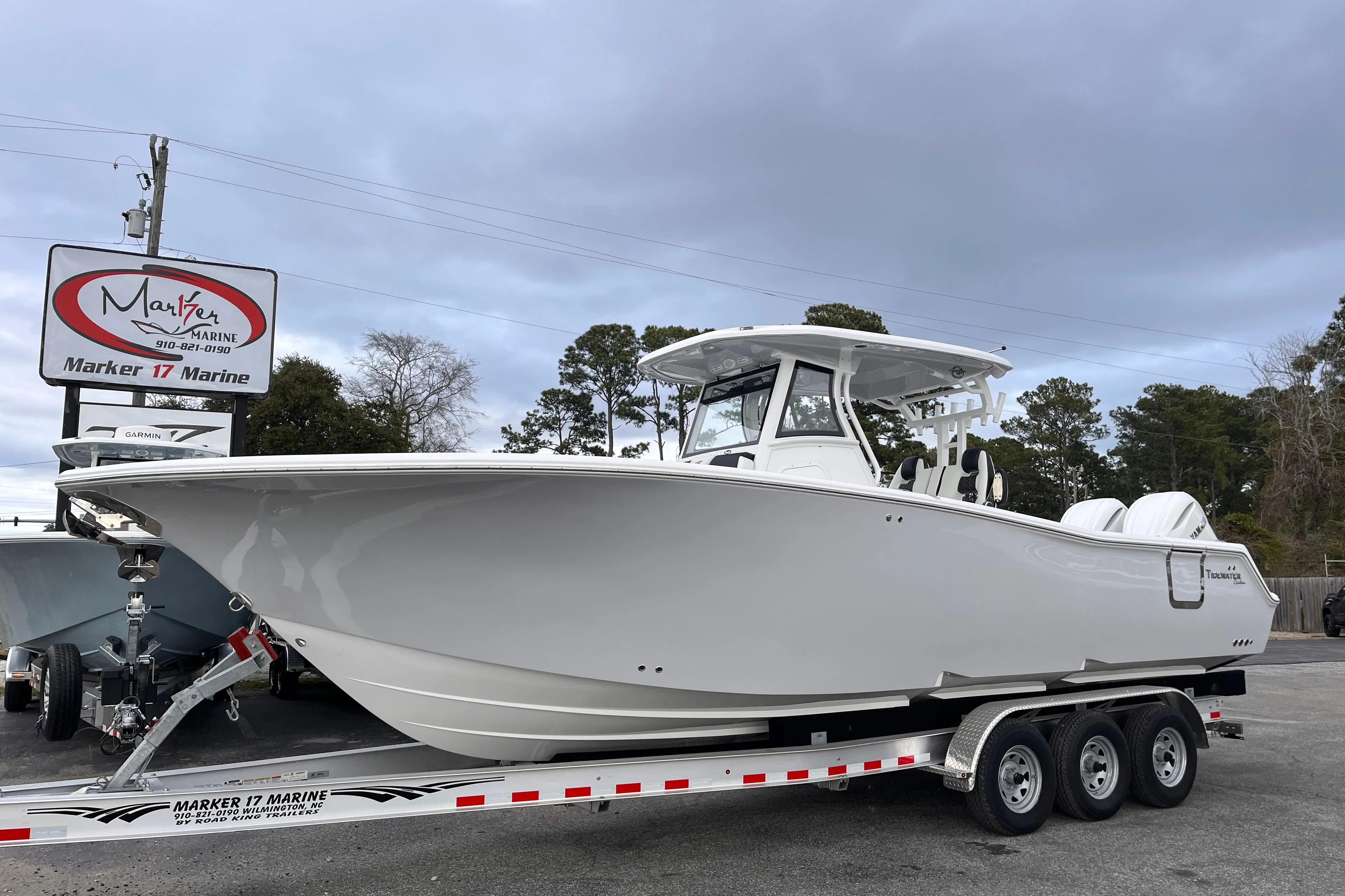 2025 Tidewater 302 CC Adventure boat on a trailer at Marker 17 Marine.