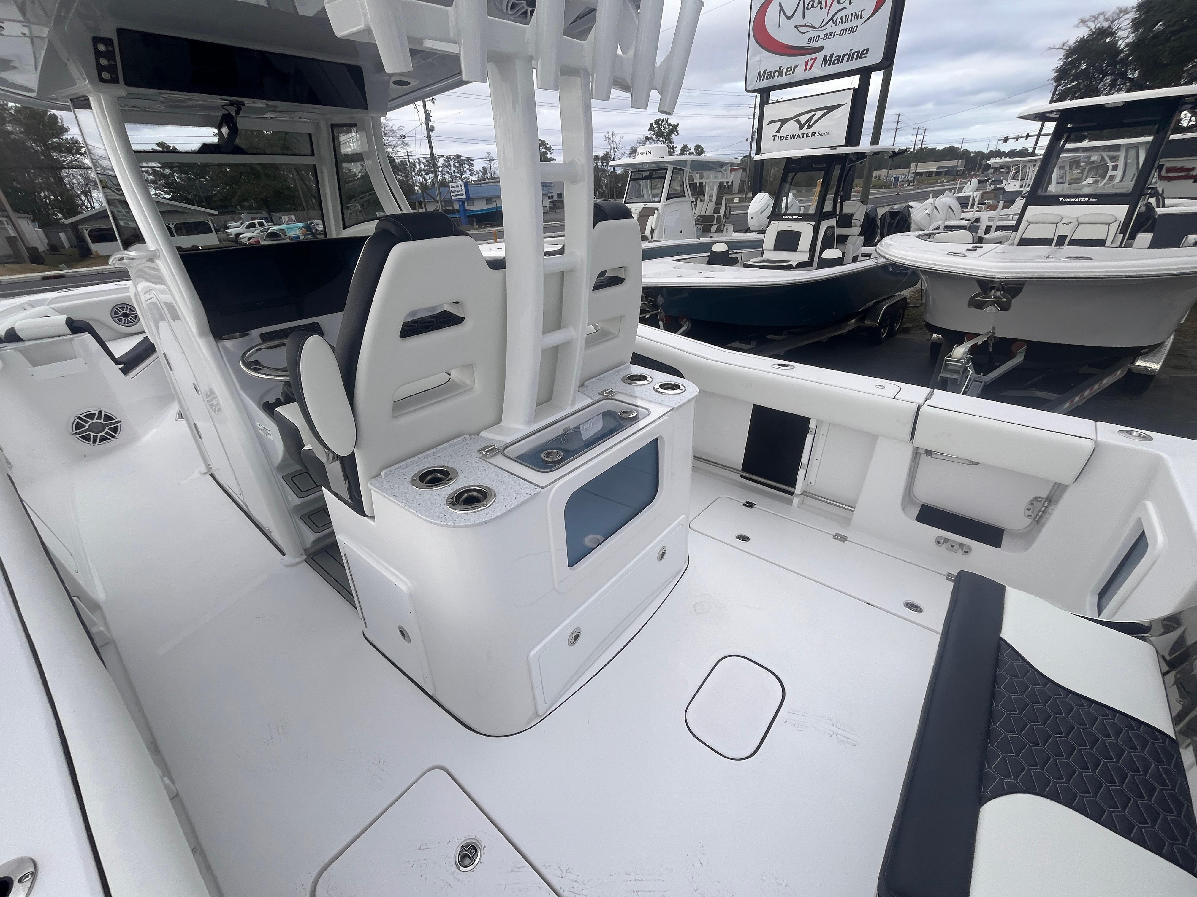 2025 Tidewater 302 CC Adventure boat interior with seating and storage features.