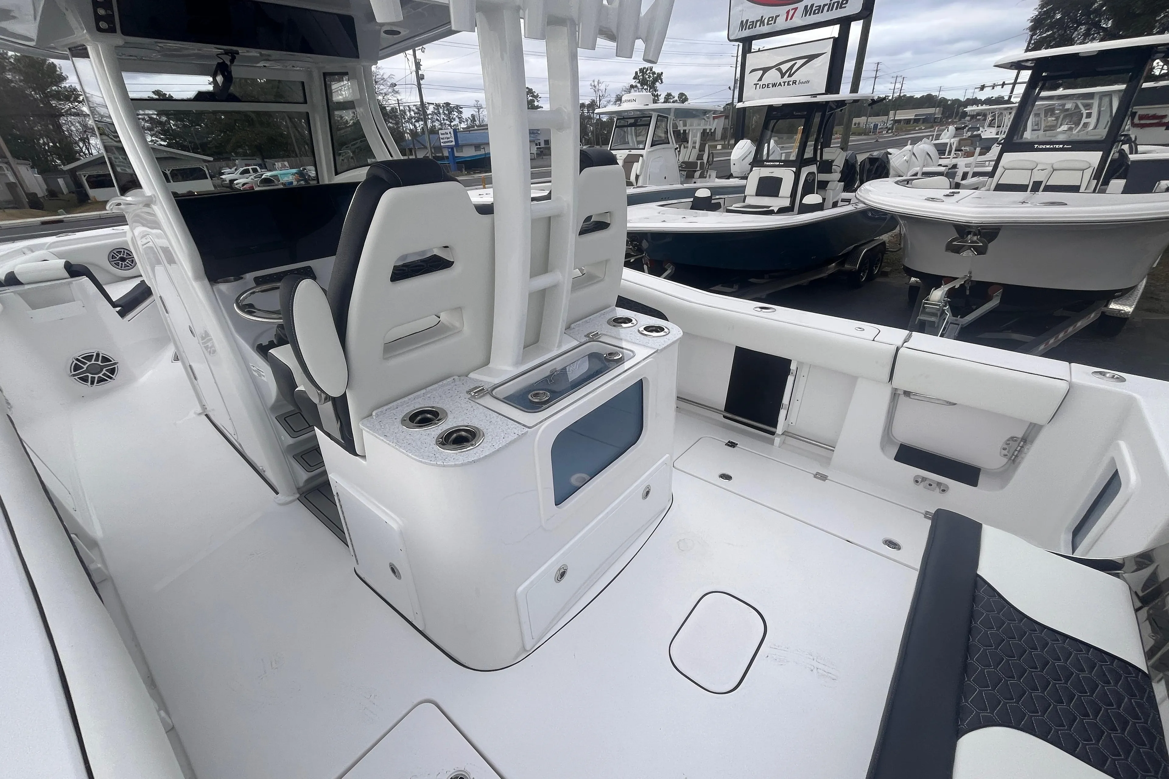 2025 Tidewater 302 CC Adventure boat interior with seating and storage features.