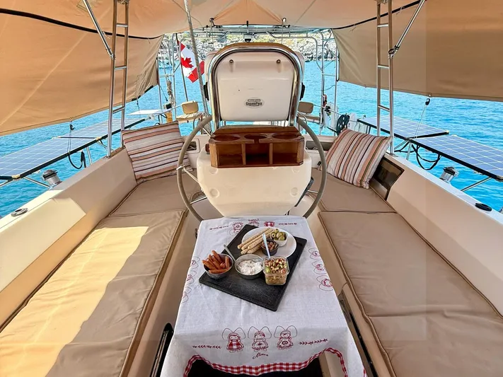  Yacht Photos Pics Luxurious 2008 Island Packet 465 yacht interior with elegant dining setup and scenic ocean view.