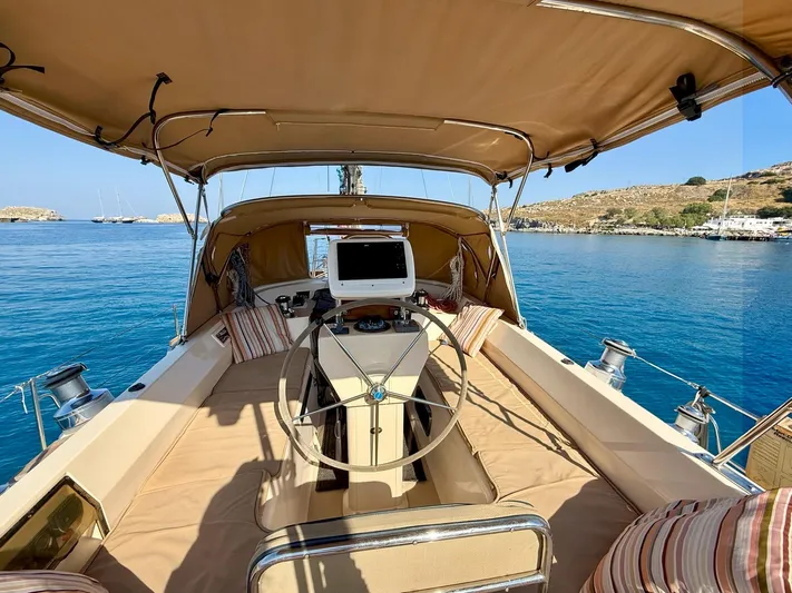  Yacht Photos Pics 2008 Island Packet 465 sailboat cockpit with helm, cushions, and ocean view.