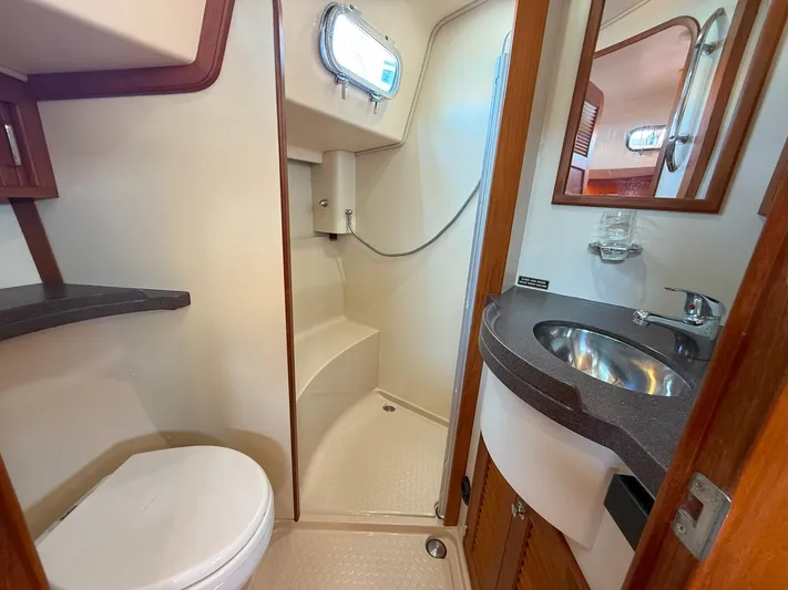  Yacht Photos Pics 2008 Island Packet 465 yacht bathroom with shower, sink, and toilet.
