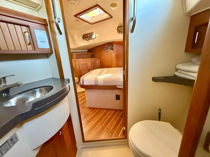 Yacht Photos Pics Interior of 2008 Island Packet 465 yacht showing bathroom and cozy cabin.