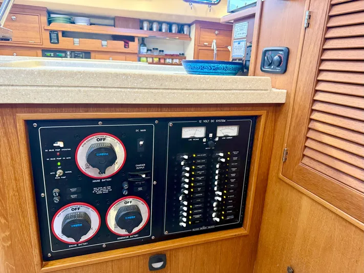  Yacht Photos Pics Electrical panel of a 2008 Island Packet 465 yacht, featuring switches and gauges.