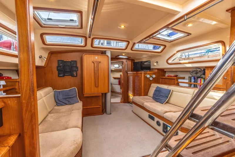  Yacht Photos Pics Luxurious interior of 2008 Island Packet 465 yacht with plush seating and wooden accents.