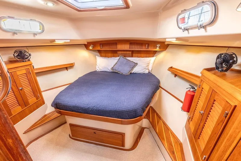  Yacht Photos Pics Luxurious 2008 Island Packet 465 yacht cabin with cozy bed and elegant wood finish.