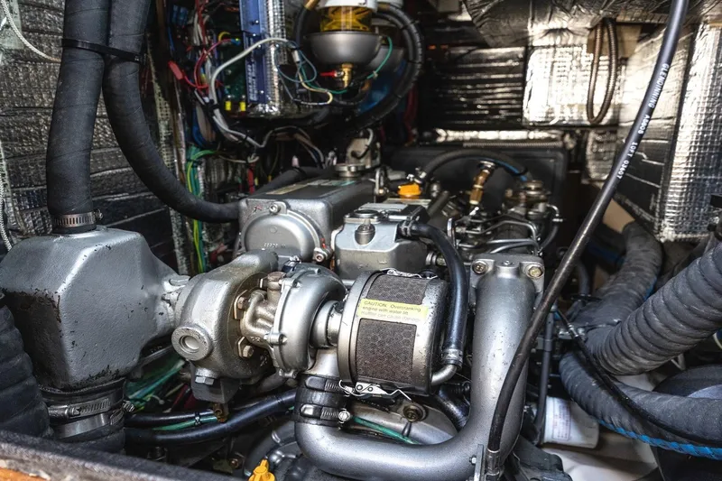  Yacht Photos Pics Engine room of 2008 Island Packet 465 yacht, showcasing complex machinery and wiring.