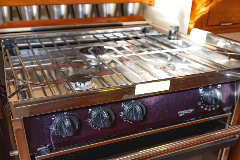  Yacht Photos Pics Stove in 2008 Island Packet 465 yacht kitchen, featuring multiple burners and control knobs.