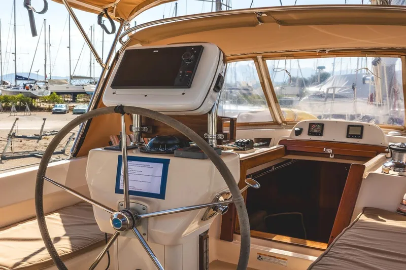  Yacht Photos Pics 2008 Island Packet 465 yacht cockpit with navigation equipment and steering wheel.
