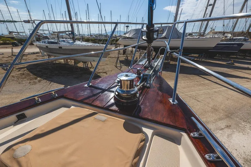  Yacht Photos Pics 2008 Island Packet 465 sailboat deck with winch, docked among other boats.