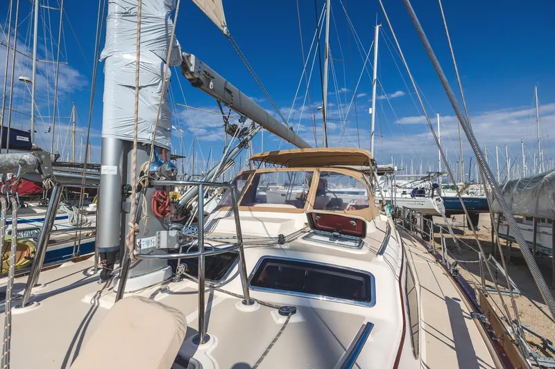  Yacht Photos Pics 2008 Island Packet 465 sailboat docked in a marina under a clear blue sky.