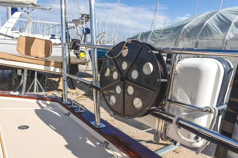  Yacht Photos Pics 2008 Island Packet 465 yacht deck with safety equipment and marina background.