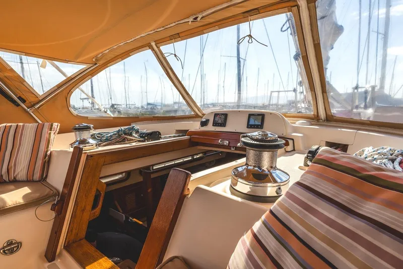  Yacht Photos Pics 2008 Island Packet 465 yacht cockpit with striped cushions and navigation equipment.