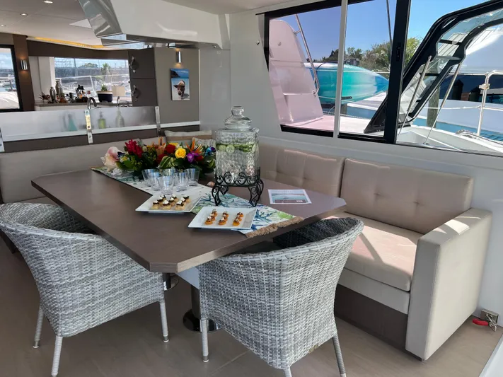  Yacht Photos Pics Luxurious interior of 2020 Bali 4.8 yacht with elegant dining setup.